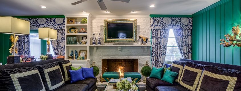 Living room with fireplace burning